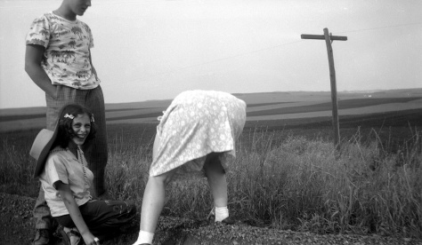 Lavonne Hanneman can't resist laughing as her mother Ruby bends down to pick up rocks on a trip to South Dakota in 1947.