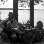 Carl F. Hanneman and an unidentified boy at the Hanneman picnic table.
