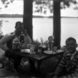 Carl F. Hanneman and an unidentified boy at the Hanneman picnic table.