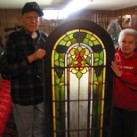 David and Mary Hanneman with a section of stained glass window on the day the windows were picked up for use at St. Mary's Hospital.