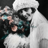 The roses in this bridal portrait of Ruby V. Hanneman were tinted. This digital restoration punched up the colors from the now-faded original from 1925.
