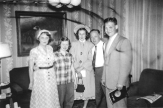 Ruby Hanneman, Ann Eckern, Elaine Hanneman, Carl Hanneman and Donn Hanneman in front of the painting in the Hannemans' Mauston home, circa 1948.